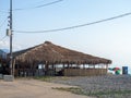 Thatched roof restaurant. Vacation at the resort. Nice secluded place. Roof of dried leaves. Rest on the sea