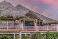 Thatched rustic hotel resort bungalow roofs at sunset