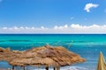 Thatched umbrellas on the beach cafe. Bali, Crete Royalty Free Stock Photo