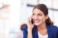 Thats awesome. an attractive young businesswoman talking on her cellphone.