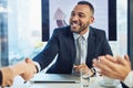 And thats how you win at business. a young businessman and businesswoman shaking hands during a meeting in a modern Royalty Free Stock Photo