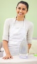 Thats my laundry all done. an attractive young woman standing and ironing clothes at home. Royalty Free Stock Photo