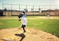 Thats the way the ball flies. a young man pitching a ball during a baseball match. Royalty Free Stock Photo
