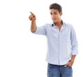 Thats the way we need to go. A handsome young man pointing his finger against a white background. Royalty Free Stock Photo