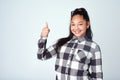 Thats what Im talking about. Studio portrait of a cute young girl giving thumbs up against a gray background. Royalty Free Stock Photo