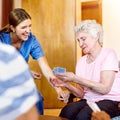 Thats a winning hand. seniors playing cards in their retirement home. Royalty Free Stock Photo