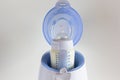 Thawing breast milk in the bottle warmer