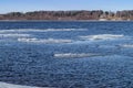 Thawing of ice on the River.The spring came.Ice floats down the river.Behind a blue haze the opposite coast is visible Royalty Free Stock Photo