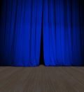 Theater blue curtain slightly open and wood stage or scene Royalty Free Stock Photo