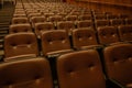 Theater or cinema auditorium with empty padded seats