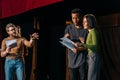 Director, multicultural actors and actress rehearsing