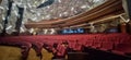 Theater with an elegant interior design with a geometric ceiling using white LED lights and red spectator seats. Royalty Free Stock Photo