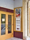 Theater entrance showing a movie poster