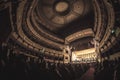 Theater full of people listening to symphony orchestra