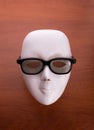 Theater mask in glasses on the table Royalty Free Stock Photo