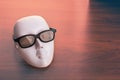 Theater mask in glasses Royalty Free Stock Photo