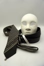 Theater or misogyny concept. Closeup of white classical theatrical mask and men clothing items as a symbol of sexual abuse or