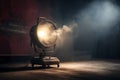 theater spot light with smoke against grunge wall