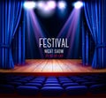 A theater stage with a blue curtain and a spotlight Royalty Free Stock Photo