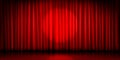 Theater stage with red curtain and round spotlight