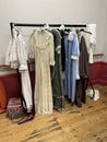 Theatre costumes hanging on a rail backstage. Royalty Free Stock Photo