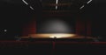 Theatre with empty stage in spotlight. Red theater curtain and seats Royalty Free Stock Photo
