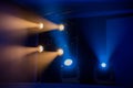 Theatre lighting equipment. The light rays from the spotlight through theatrical smoke