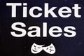 Theatre ticket sales sign with happy and sad face expressions masks