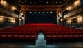 Theatrical interior with a stage and rows of comfortable seats Royalty Free Stock Photo