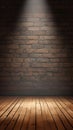 Theatrical lighting illuminates stage with brick wall and wooden floor