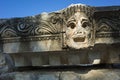 Theatrical mask stone carved relief of ancient town of Myra in Lycia region, Ruins of ancient city of Myra in Demre