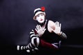 Theatrical mime in white hat