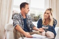 Their finances arent looking too good. a young couple looking stressed out while doing their finances together at home. Royalty Free Stock Photo