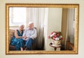 Their love is a reflection of their life. Portrait of a happy senior couple relaxing on the sofa together at home Royalty Free Stock Photo