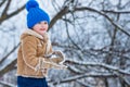 Theme Christmas holidays New Year. Winter snow and child game. Happy winter time for kid. Joyful little boy child Having Royalty Free Stock Photo