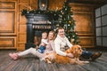 Theme Christmas and New Year family circle. Young Caucasian family with 1 year old child dog breed Labrador Golden Retriever Royalty Free Stock Photo