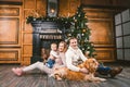 Theme Christmas and New Year family circle. Young Caucasian family with 1 year old child dog breed Labrador Golden Retriever Royalty Free Stock Photo