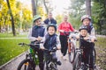 Theme family sports vacation in park in nature. big friendly Caucasian family of six people mountain bike riding in Royalty Free Stock Photo