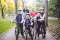 Theme family sports vacation in park in nature. big friendly Caucasian family of six people mountain bike riding in