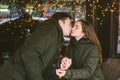 Theme love holiday Valentines Day. pair college students, Caucasian heterosexual lovers in winter, sit table of street Royalty Free Stock Photo