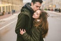 Theme love and romance. Caucasian young people heterosexual couple in love students boyfriend girl hugging and kissing on center Royalty Free Stock Photo