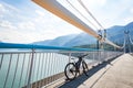 Theme of mountain biking in Scandinavia. human tourist in helmet and sportswear on bicycle in Norway on Hardanger Bridge Royalty Free Stock Photo