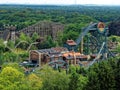 Theme park landscape with dive and wooden coaster
