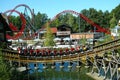 Theme park landscape with wooden coaster and Big Dipper roller coaster Royalty Free Stock Photo