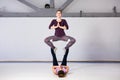 Theme sports health acrobatic yoga. A pair of two young Caucasian girls in the gym doing a throne posture base. Physical and Royalty Free Stock Photo