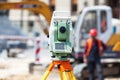 Theodolite or surveyor equipment tacheometer outdoors at construction site