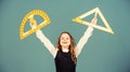 Theorems and axioms. Smart and clever concept. Girl with big ruler. School student study geometry. Kid school uniform Royalty Free Stock Photo