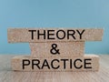 Theory and practice symbol. Brick blocks with words \'Theory and practice\'