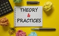 Theory and practice symbol. White note, words `Theory and practice` on beautiful yellow table, colored paper, colored pencils, Royalty Free Stock Photo