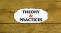 Theory and practices symbol. Words `Theory and practices` on white paper. Beautiful wooden background. Business, theory and